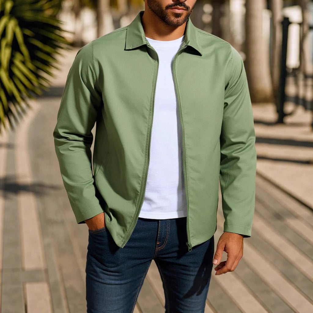 Man wearing an emerald green zippered cardigan jacket with raglan sleeves.