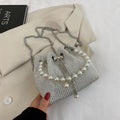Light diamond shoulder crossbody bag with chain strap and bucket shape in soft PU.