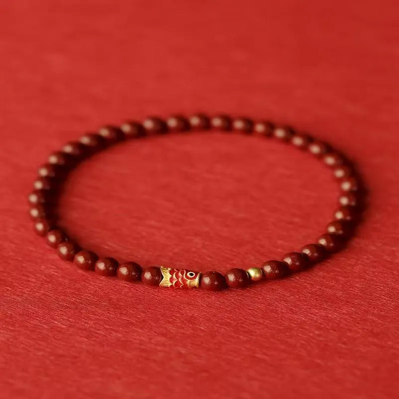 Natural cinnabar koi bracelet with golden carp model in national style