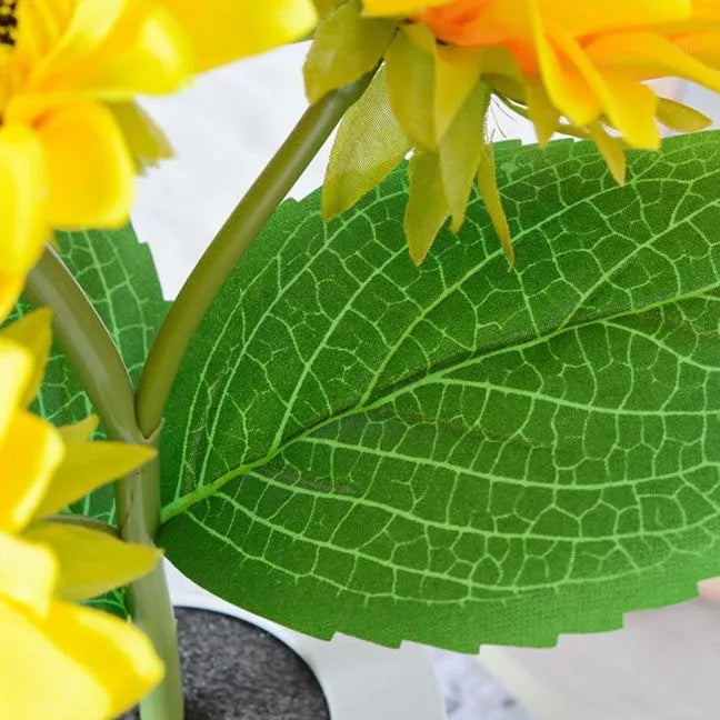 Rechargeable artificial sunflower LED night light on a table