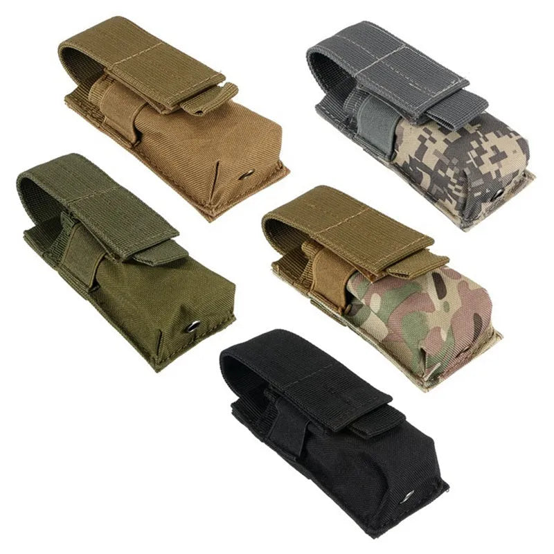 Outdoor military waistbag in black with MOLLE straps, holding a small flashlight and pistol cartridges