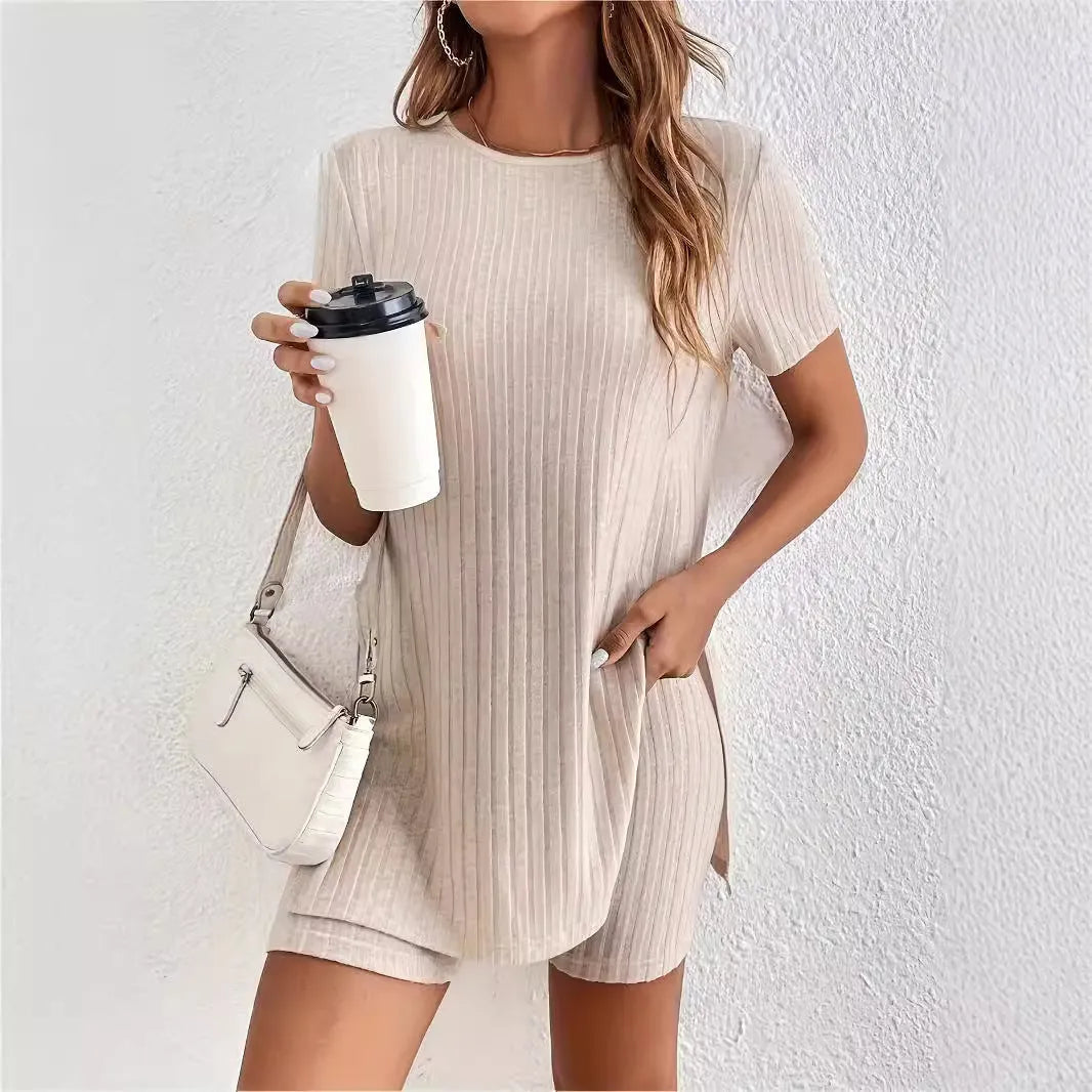 Women's black cotton two-piece shorts set with ribbed crew neck top and matching shorts on a hanger.