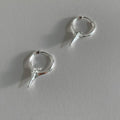 Geometric star ear clips with white gold electroplating on copper, showing secure clip mechanism and detailed star shape