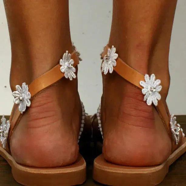 Brown ladies casual beach Roman sandals with herringbone toe and floral pattern on artificial PU upper