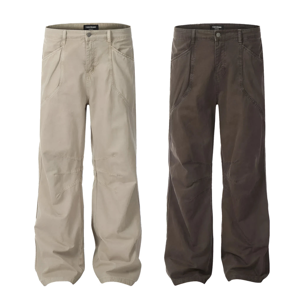 Men's brown straight-leg trousers with high waist and non-ironing cotton fabric on a hanger