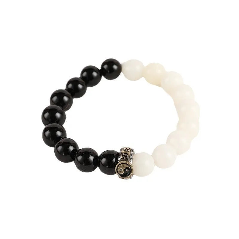 Black and white obsidian bracelet with taiji symbol and geometric beads