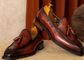 Men's black genuine leather fringed slip-on loafers with rubber soles and British styling
