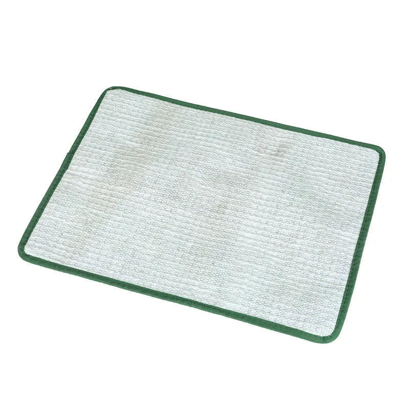 Green washable dog grass pee pad on a patio for pet potty training