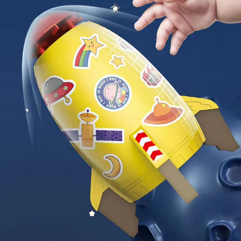 Yellow water pressure rocket launcher toy for kids outdoor garden play on a green lawn.