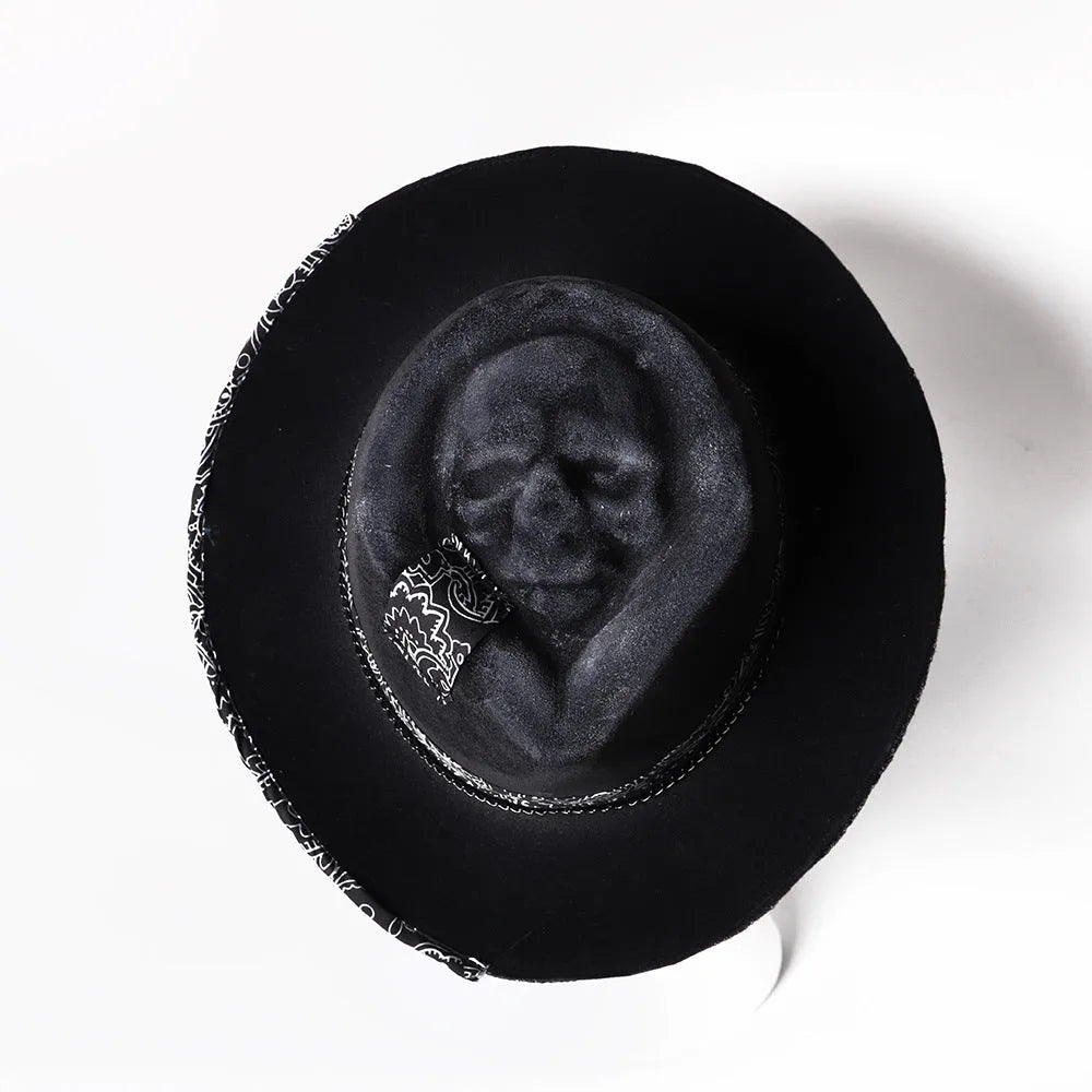 Handmade wool felt skull hat with conical crown showing integrated skull pattern design