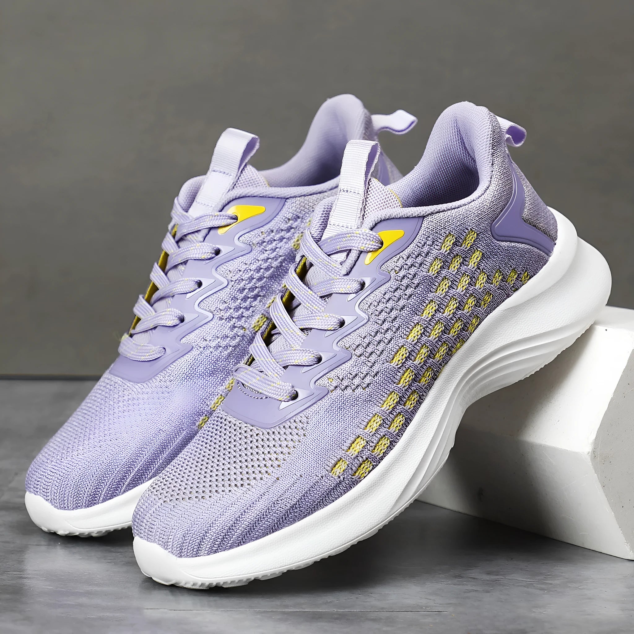 Women's lavender purple Flyknit running shoes with stripe pattern and mesh lining.