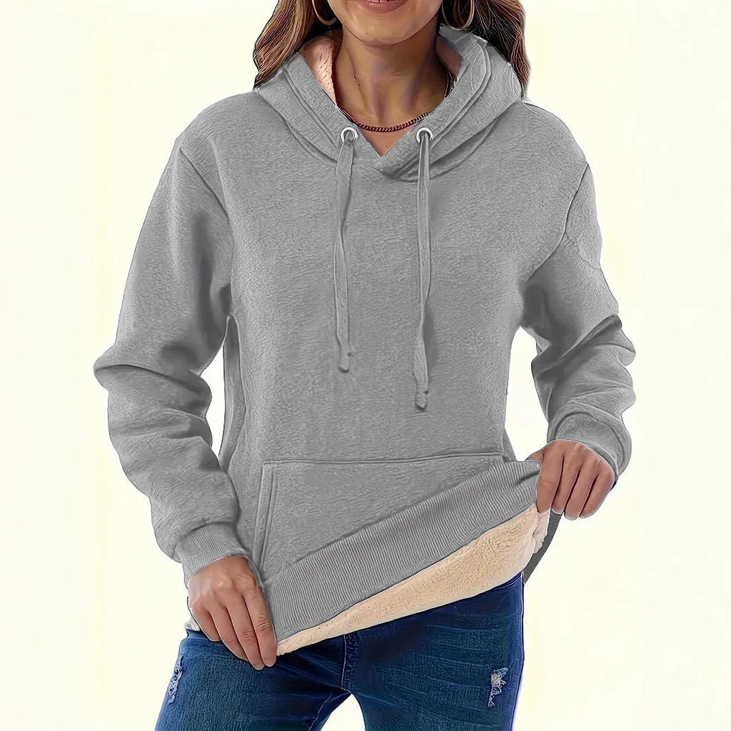 Women's black hooded sweater with a textured 3D pattern, loose fit, and front pockets.