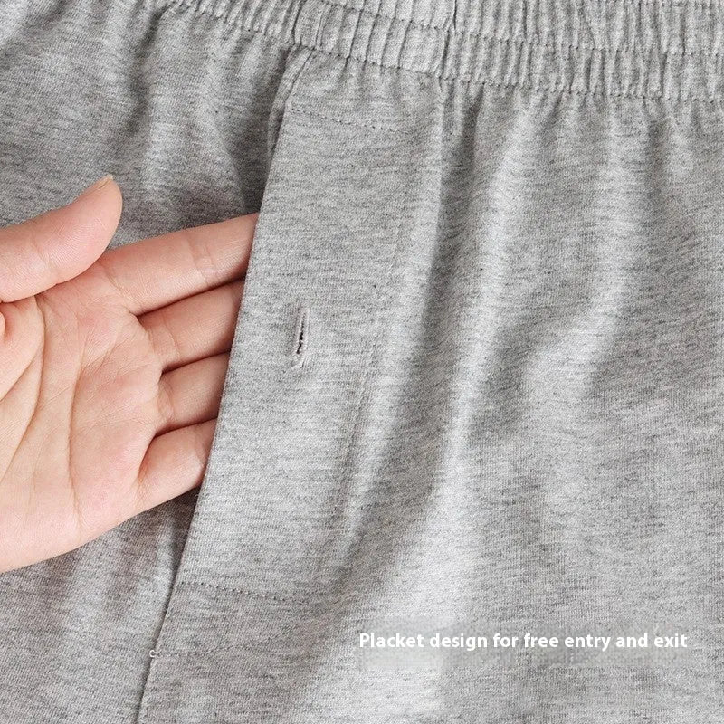Men's high-waist cotton boxer shorts in light grey, navy blue, and black colours showing knitted fabric texture