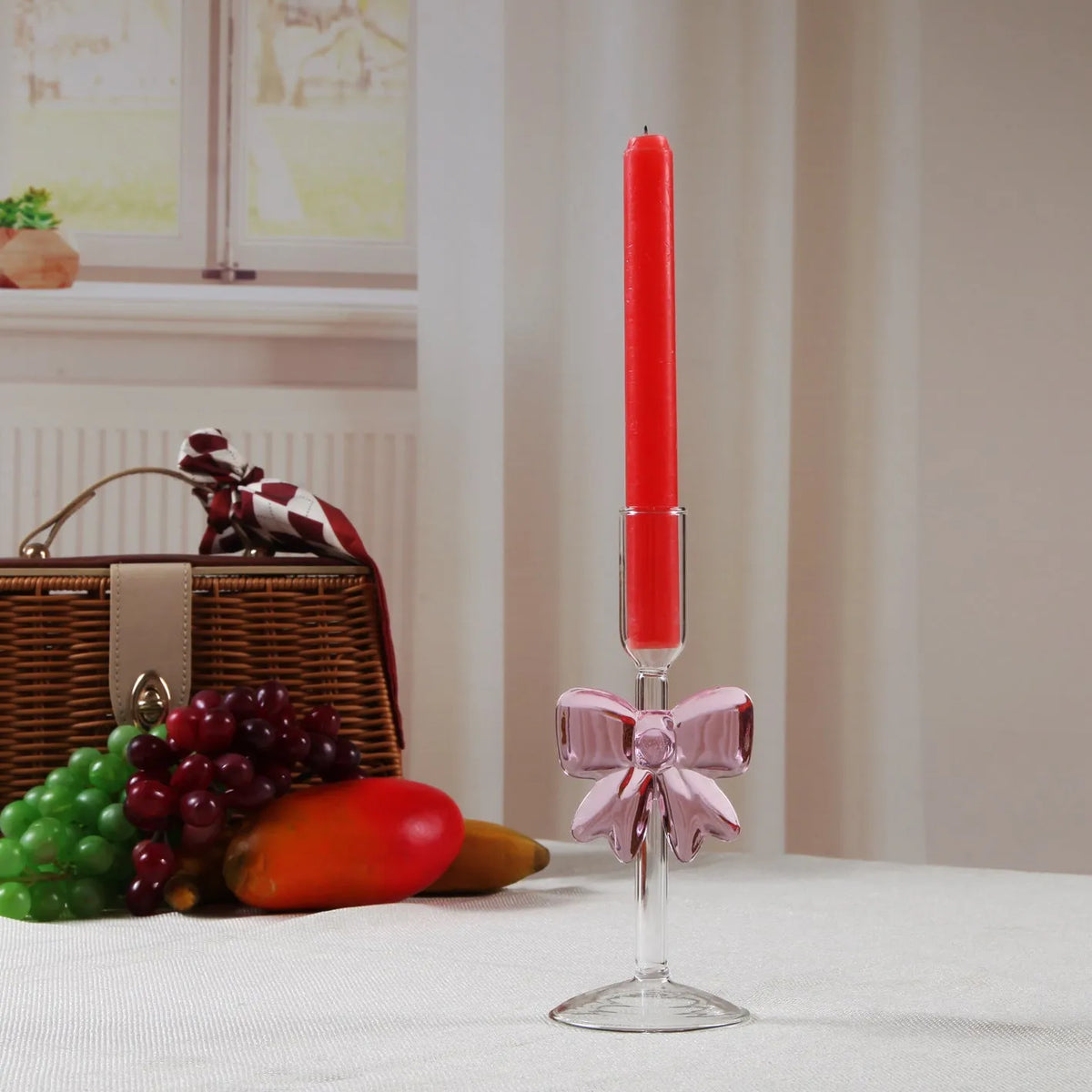 Handmade borosilicate glass bow candlestick holder with 2cm inner diameter and 7cm base, available in three heights