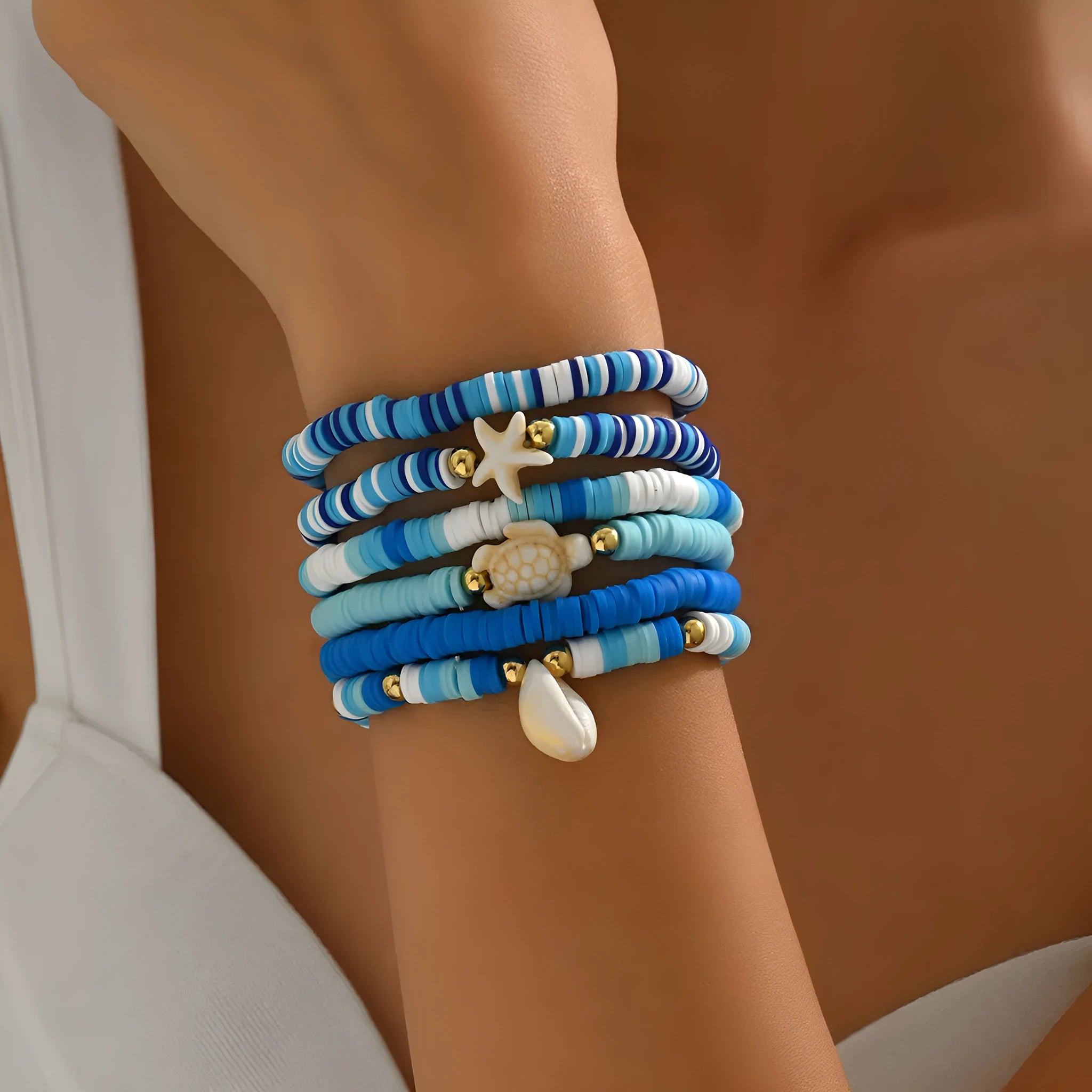 Six handmade polymer clay bracelets with geometric shapes and shell decorations in bohemian blue S3162 colour