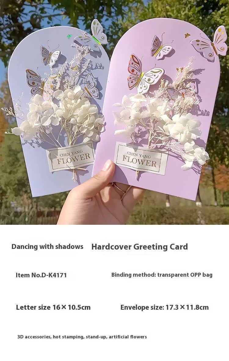 Handmade 3D butterfly greeting card showing stand-up design with artificial flowers on coated paper