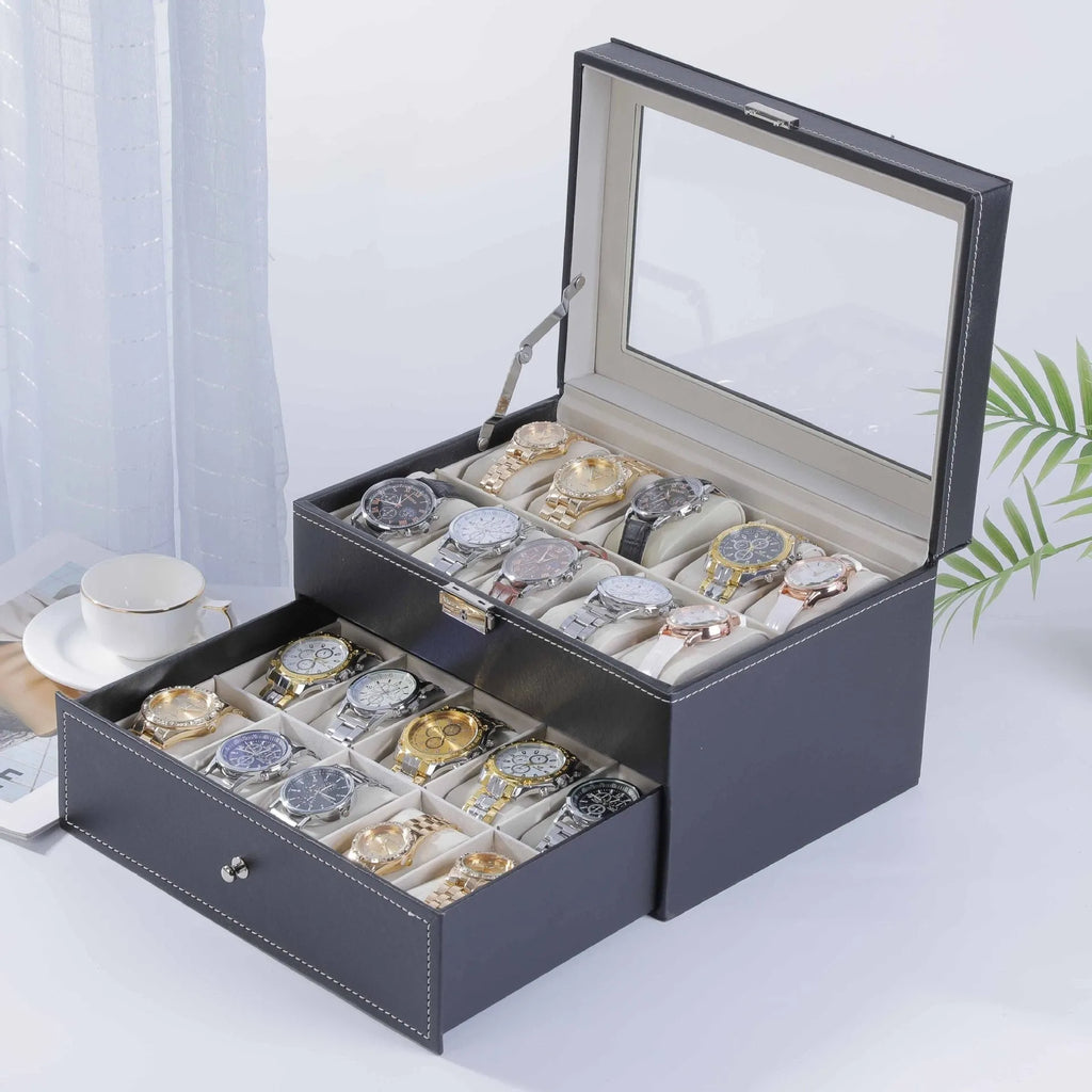 Grey leather watch storage box with see-through lid showing watch compartments