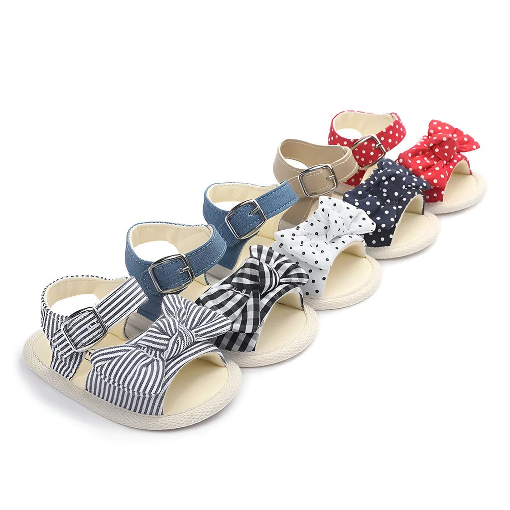 White and Black Velcro fastening low-top toddler shoes for sizes 11cm, 12cm, and 13cm.