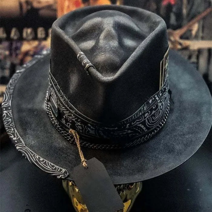 Handmade wool felt skull hat with conical crown showing integrated skull pattern design