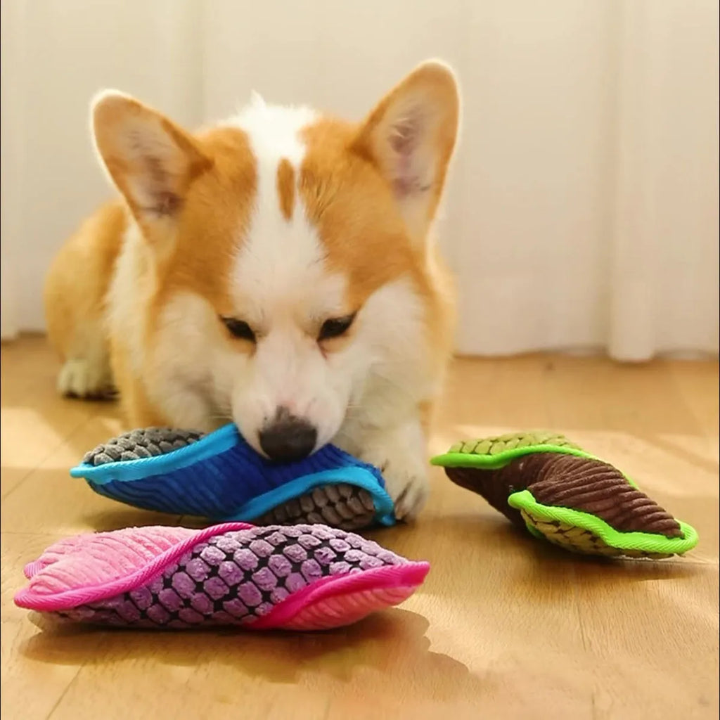 Blue, green, and pink plush dog bone toys with squeakers and soft corn fleece lining.