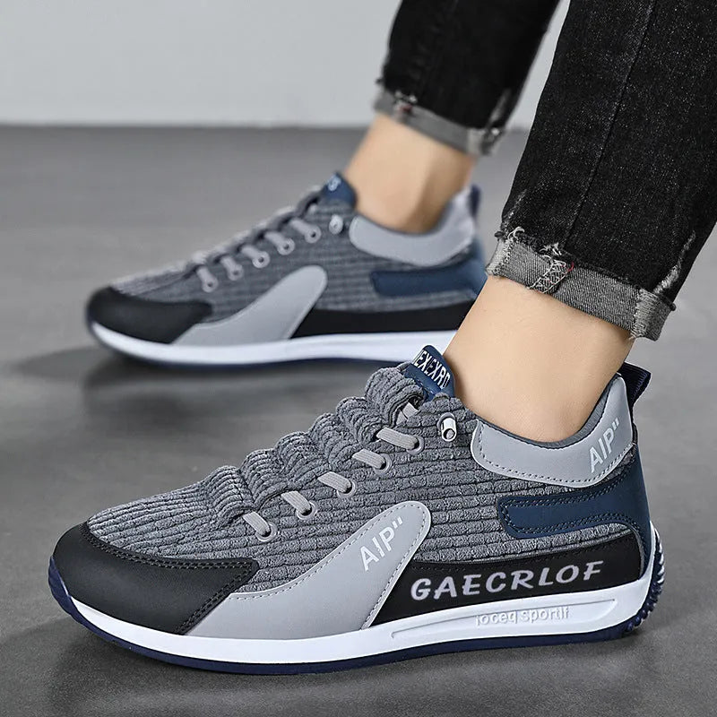 Men's grey and green mesh running shoes with low-top design and round toe