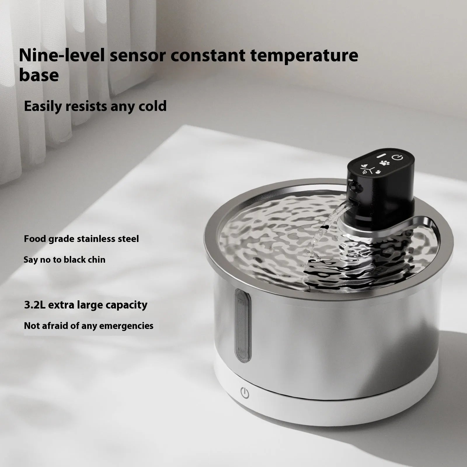 White stainless steel cat water fountain with heating base and USB cable on a kitchen floor
