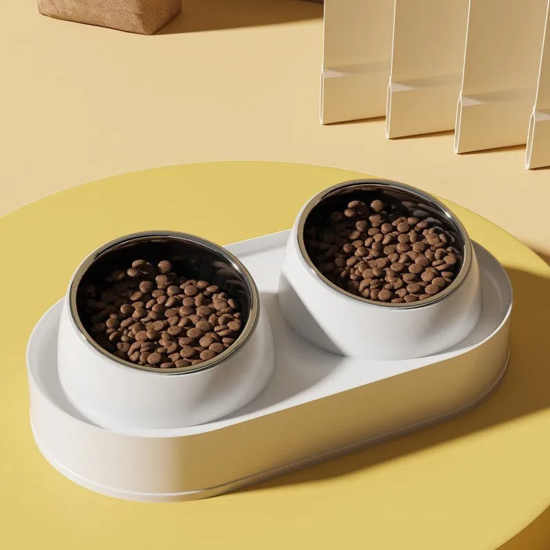 White elevated pet feeder with tilted ceramic bowls on a separate rack, for cats and small dogs.