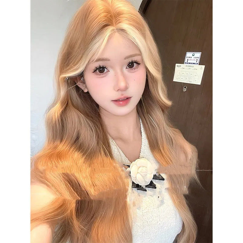Long curly lace front wig in American highlight gold colour on display