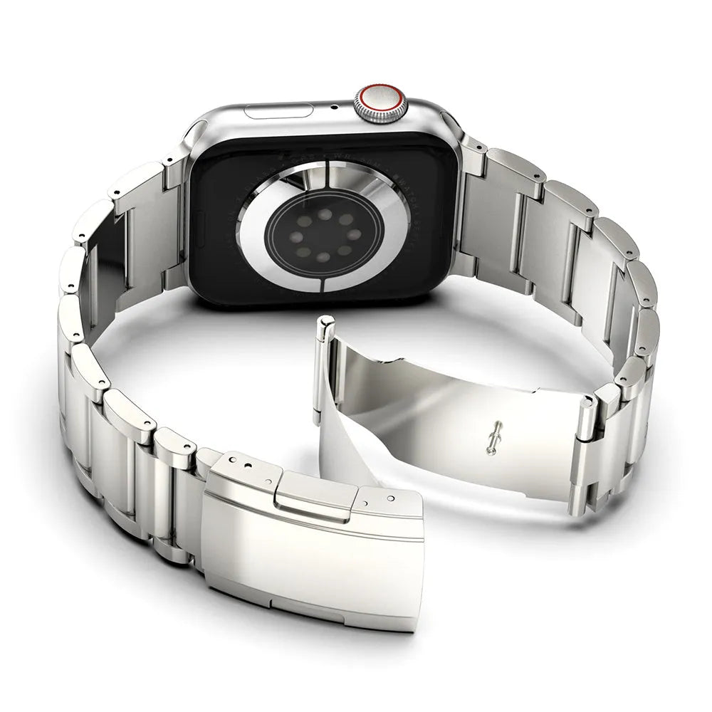 Black titanium alloy Apple Watch replacement strap with folding buckle on a wrist