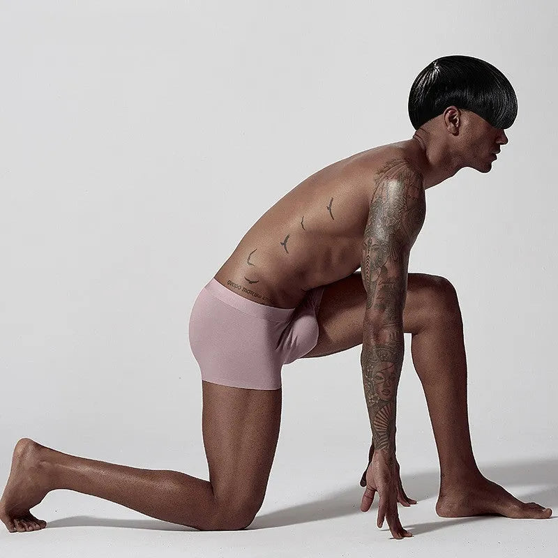 Men's seamless modal underwear in green colour showing mid-waist design and body shaping features