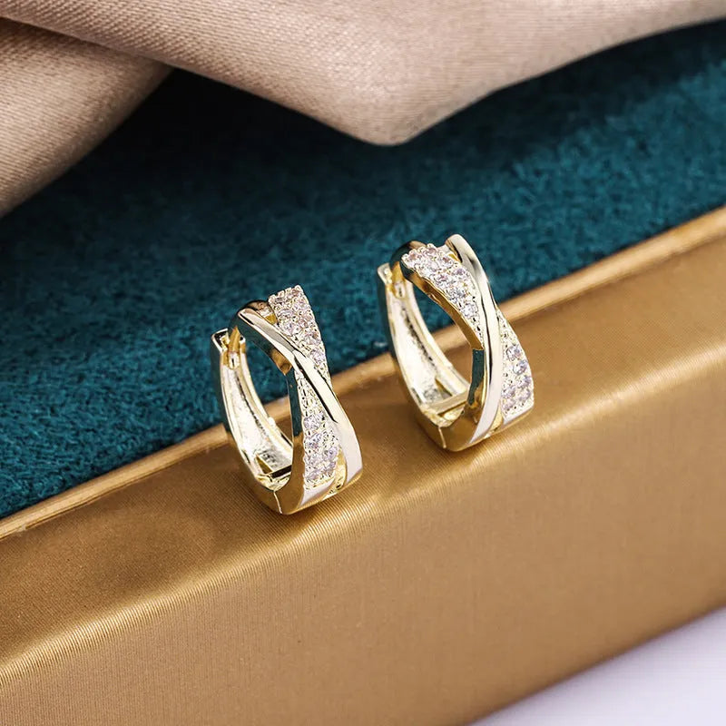 Geometric stud earrings with 14K yellow gold plating and zircon accents on copper base