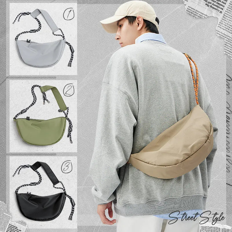 Men's lightweight nylon messenger bag in a solid colour, shown with a large main compartment.