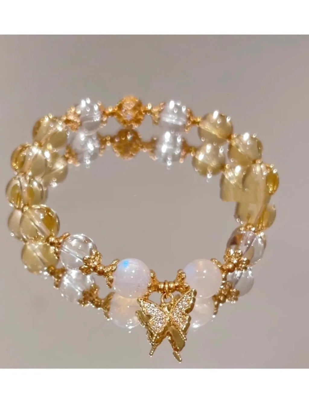 Moonstone white crystal bracelet with diamond-shaped beads and citrine butterfly charm in Chinese style design
