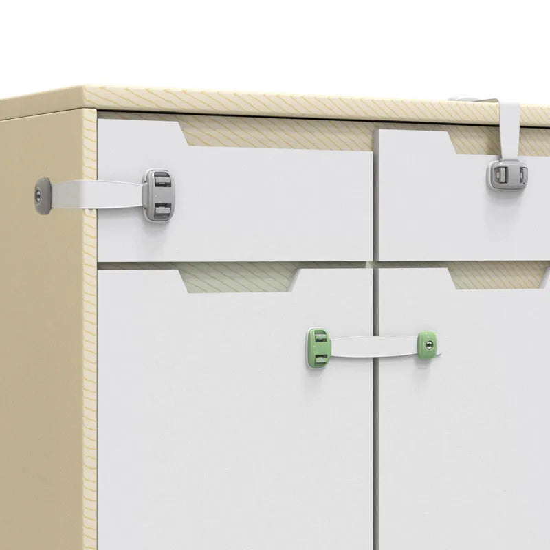Grey and green adjustable adhesive child safety lock straps for cabinets and drawers.