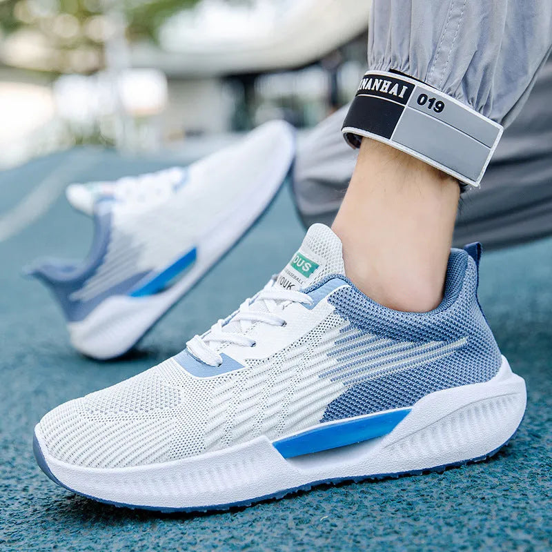 Men's blue casual mesh shoes with cloth upper and injection-moulded plastic sole on grey background