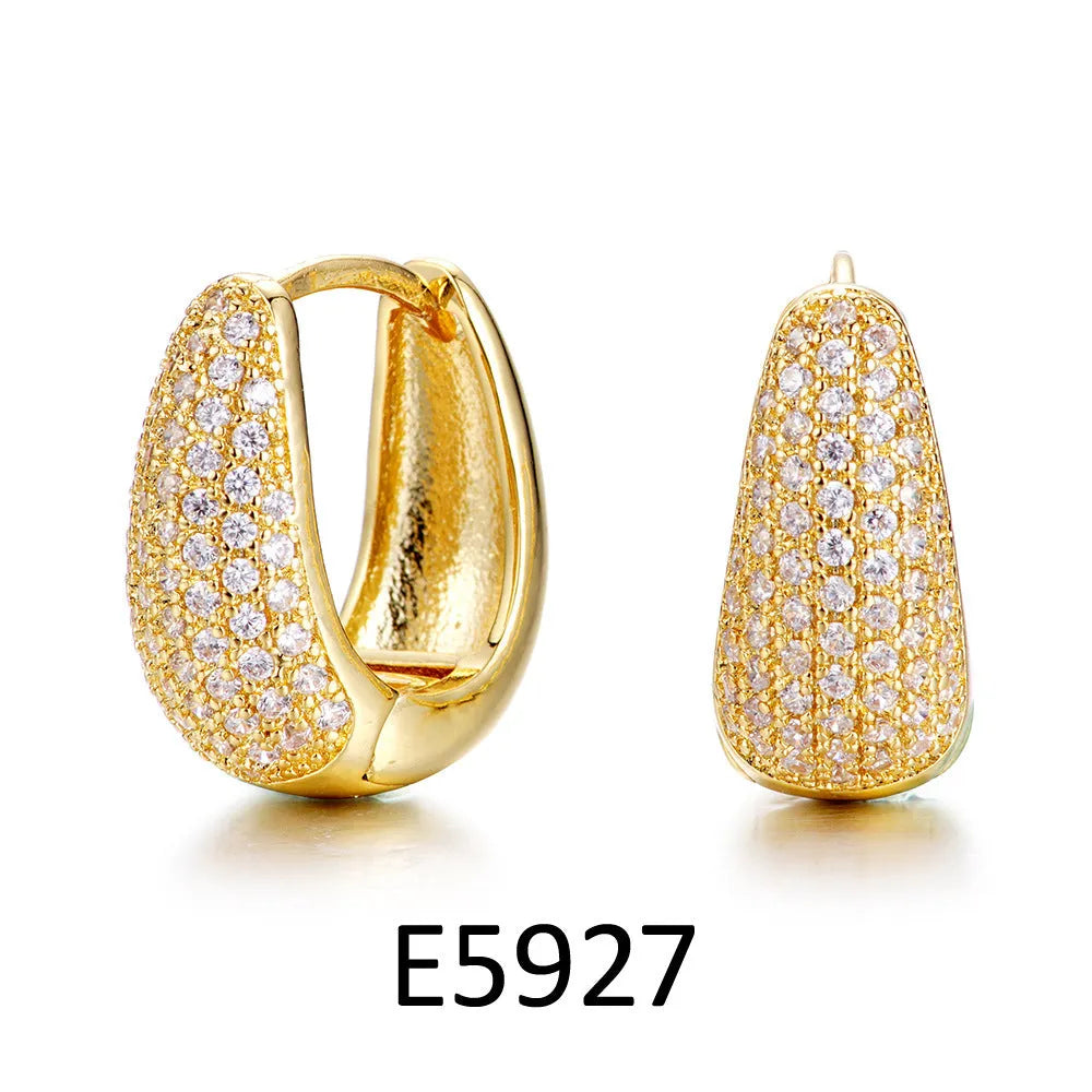 Brass gold-plated heart-shaped ear clip earrings with gang drill elements and zircon accents on copper base