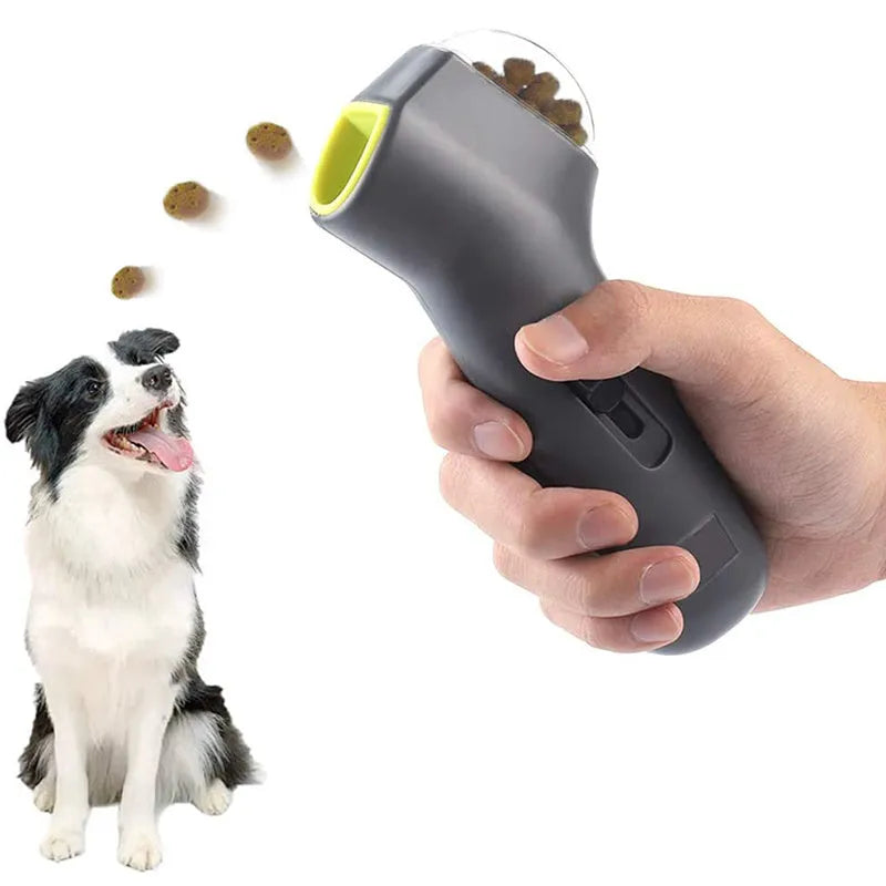 Grey pet snack catapult launcher measuring 18 cm long with spring trigger for 3-metre treat ejection