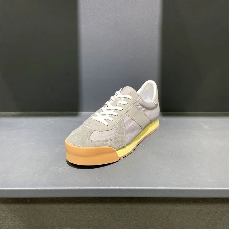 Men's black summer sports shoes with mesh panels, suede leather, and a herringbone pattern on the toe.