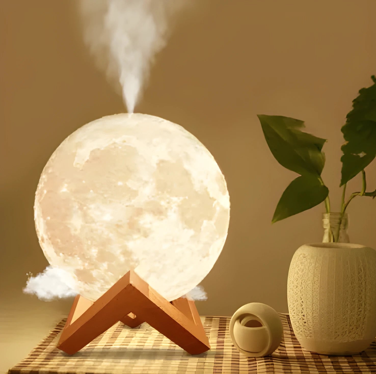 Spherical white lunar humidifier and night light with USB charging port and soft LED glow.