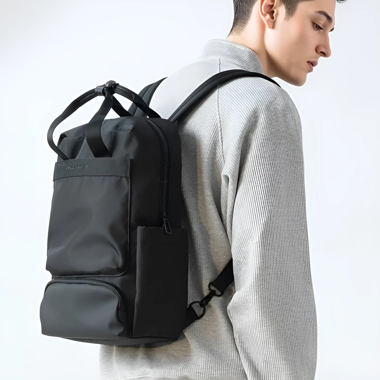 Elegant black Oxford cloth computer backpack showing 20-35 litre capacity
