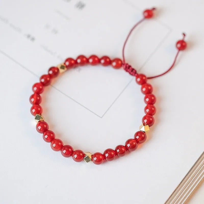 Hand-woven red agate bead bracelet with diamond pattern and lucky charm in ethnic style