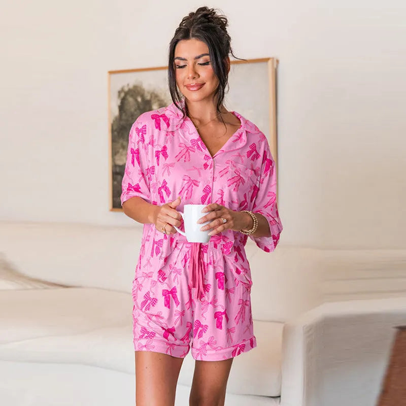 Pink bow print pajama two-piece set with top and trousers, lightweight polyester fabric for sleep and home use