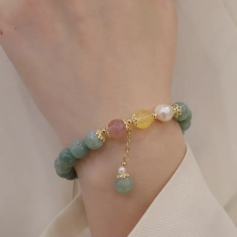 Green Myanmar jade beaded bracelet with pearls and 3D decoration in a geometric Han style design.