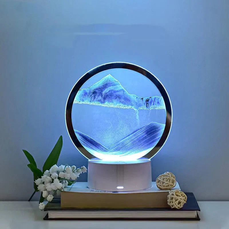 Creative 3D quicksand table lamp with glass shade on a table, showing touch control and USB cable.