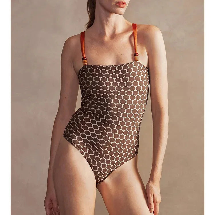 Women's printed dots pattern one-piece swimsuit with matching wrap skirt, shown in multiple colours.