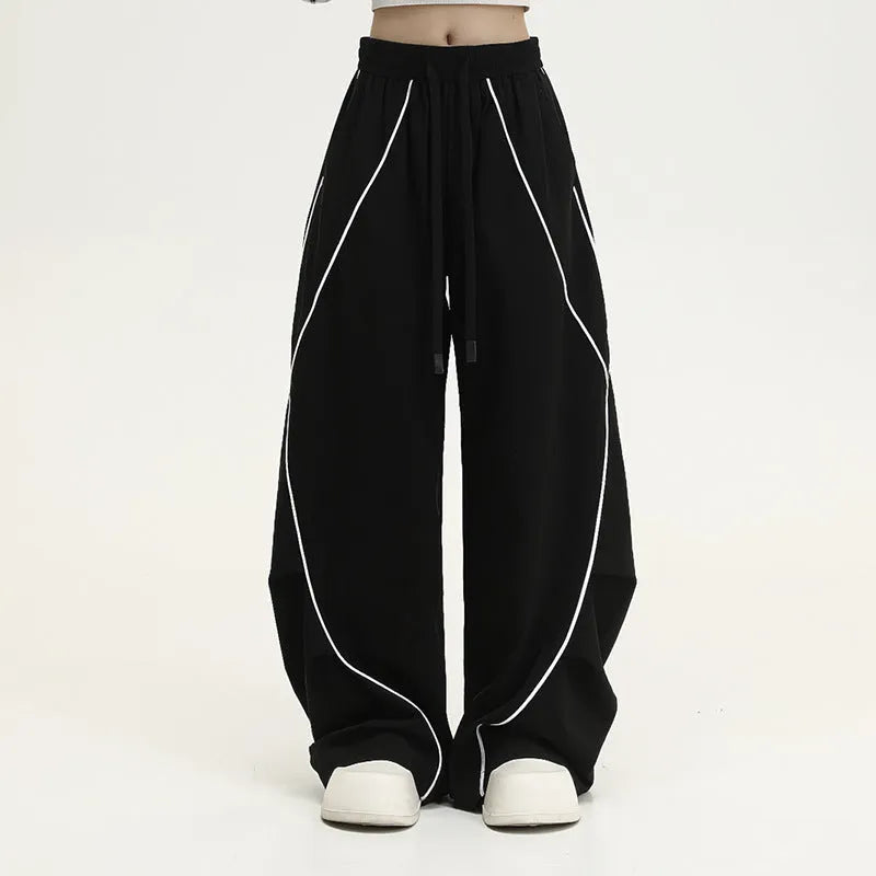 Black pleated wide-leg sports trousers with striped pattern and mid-waist design