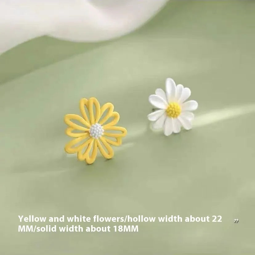 A pair of alloy flower stud earrings in a blue and orange two-tone colour contrast on a white background.