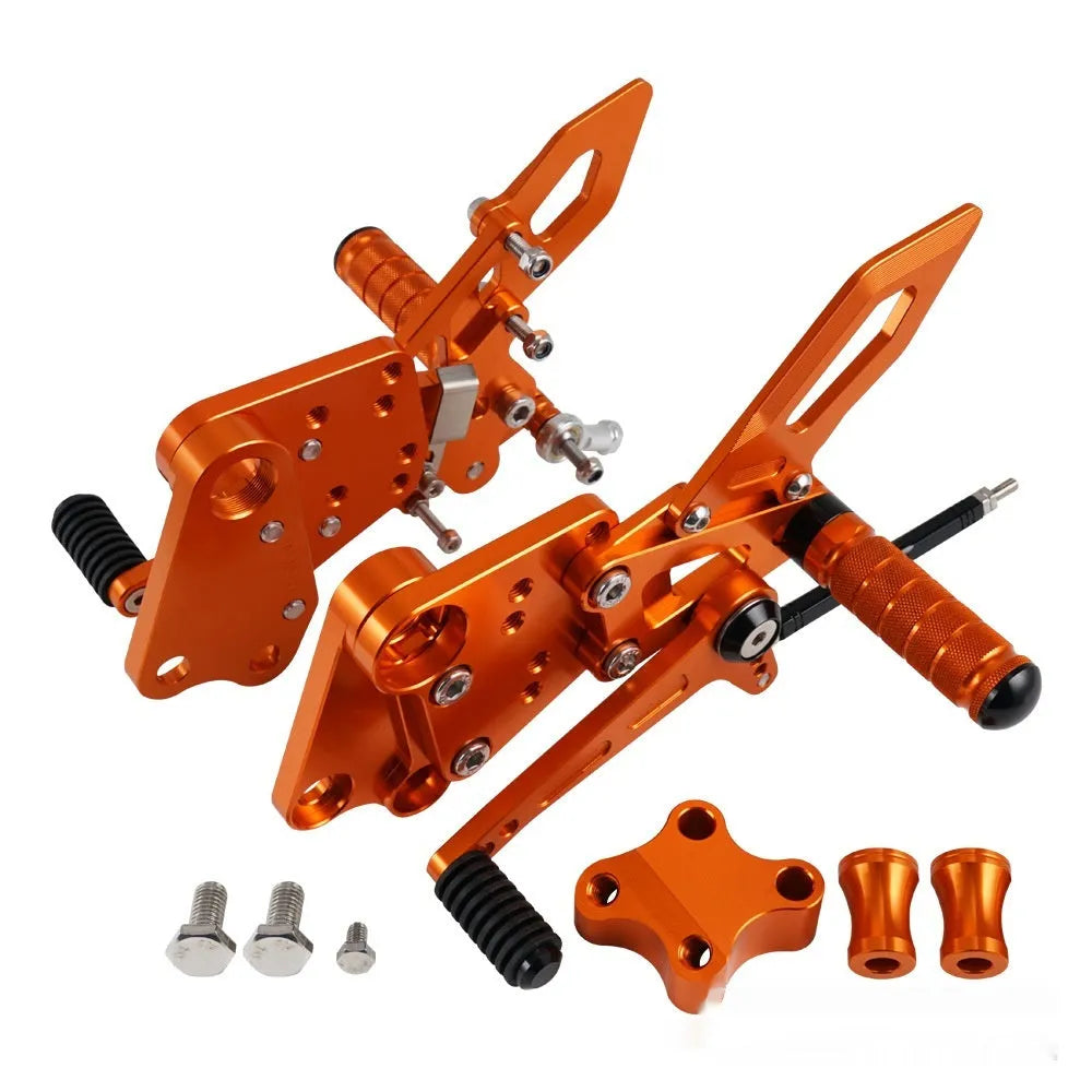 KTM Duke motorcycle rear shift pedal support assembly kit in black and orange.
