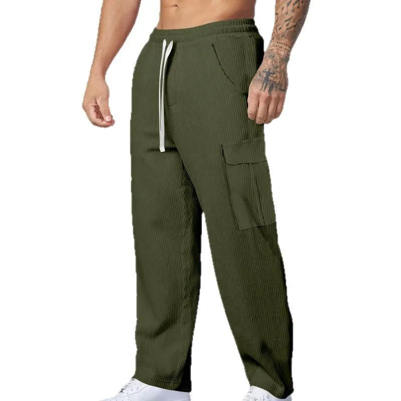 Men's straight-leg corduroy cargo trousers in navy blue with drawstring waist, suitable for casual autumn wear.