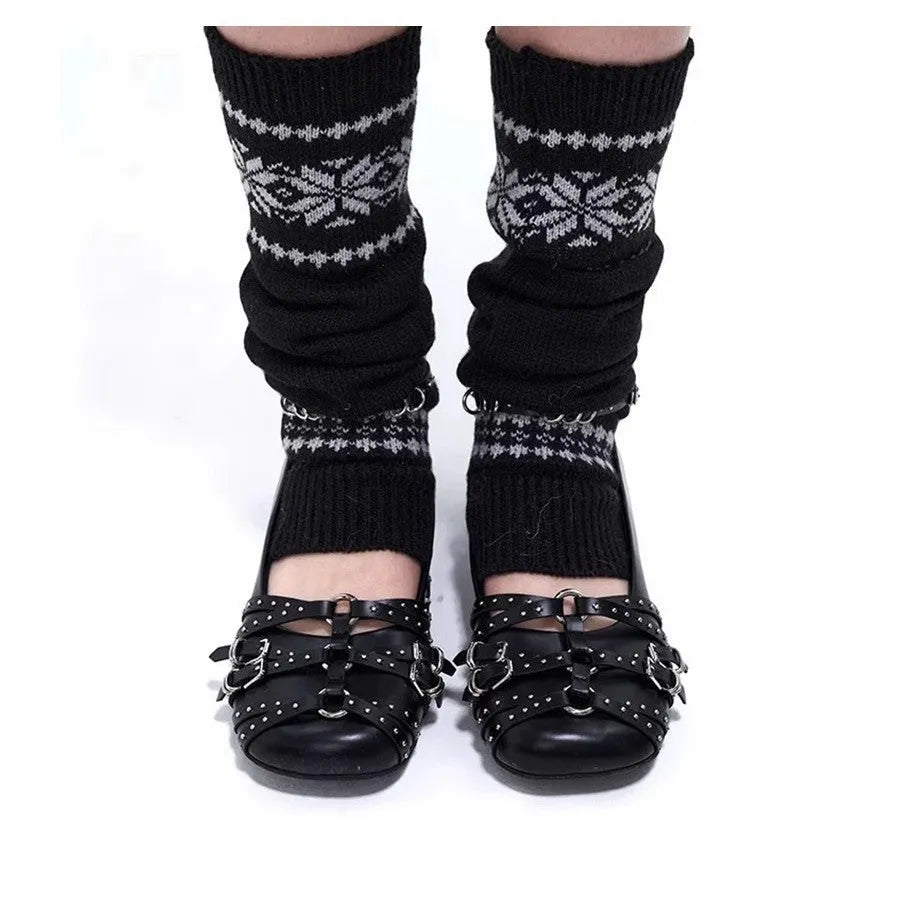 Women's black patent leather square-toe pumps with a buckle fastening and low flat heel.
